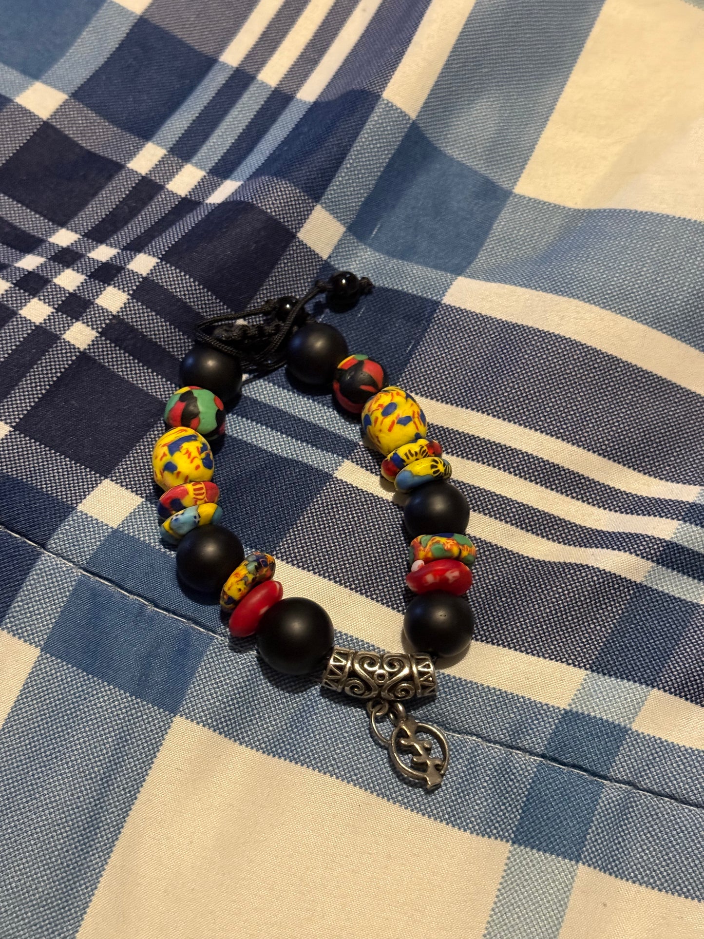 Colorful African Beaded Bracelet with Adinkra Symbol Charm | Handmade Adjustable Tribal Jewelry | Ethnic Black & Multicolor Statement Bracelet
